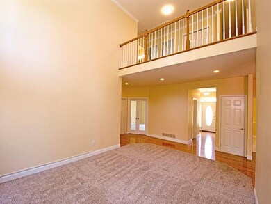 Gleeming hardwood extends from the entry, back the