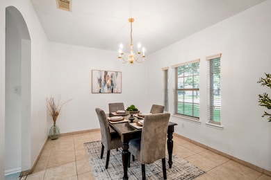 This formal dining room is framed by a trio of fro