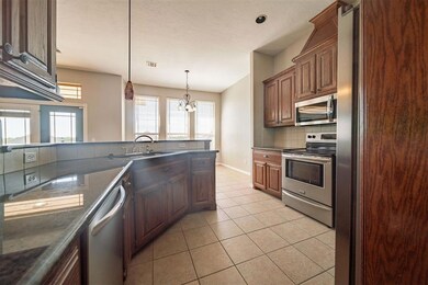 Kitchen featuring a sink, decorative backsplash, a