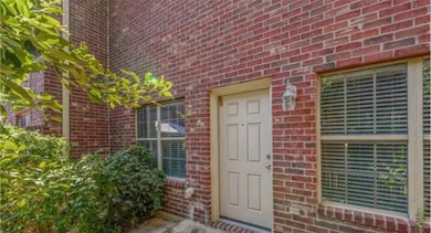 Property entrance with brick siding