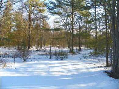 Land. Sited on a 3-acre wooded lot...