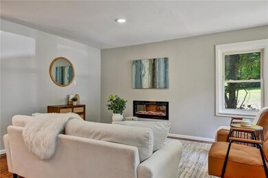 Living room with wood-type flooring