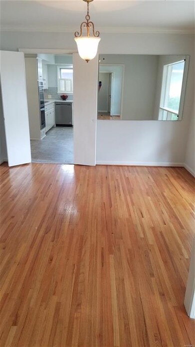 This LARGE Dining Room has TONS of natural light w