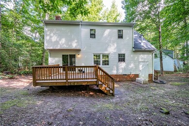 Rear view of property with a wooden deck