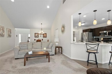 living room featuring vaulted ceiling