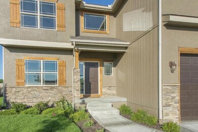 Stamped sidewalk. Covered front entry way. Cedar t