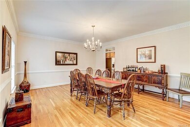 Large formal dining room with dental moulding and 