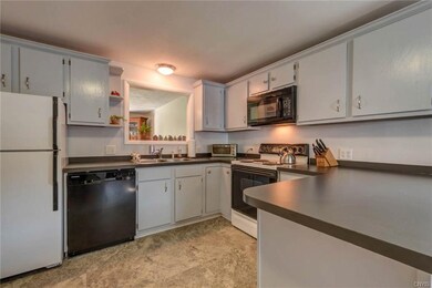 Large, eat in kitchen with breakfast bar. Open to 