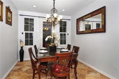 Dining room opens up towards living room, and has entrance to side yard with access to back yard, great for BBQs!