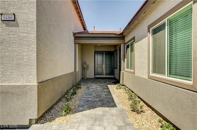 Property entrance with stucco siding