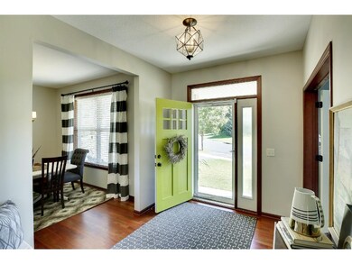 Inviting front entry with gleaming hardwood floors