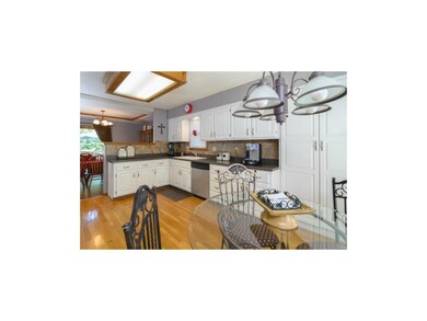 Eat in Kitchen has updated lighting, pantry and ha