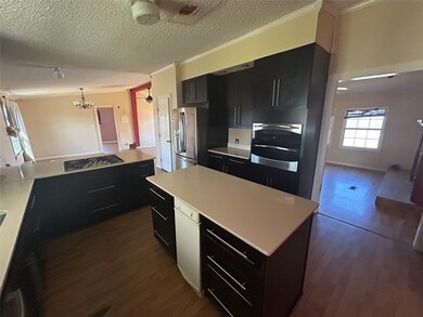 Kitchen with stainless steel appliances, dark cab