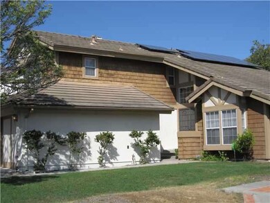 FRONT ENTRANCE ALCOVE AND SOLAR PANELS