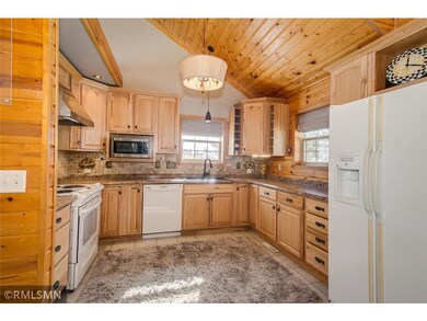 Large open kitchen with vaulted ceilings.
