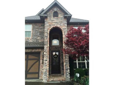 Facade/Exterior Front. Grand entry 8 foot solid wood door.