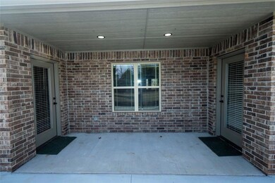 Back Patio with entrances to main bedroom and dini