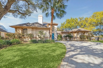 WIDE BRICK DRIVEWAY OFFERS PLENTY OF PARKING.