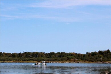A local workboat harvests sea weed...