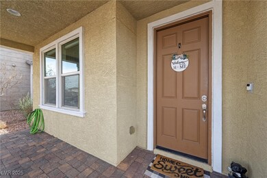 Doorway to property featuring stucco siding and co