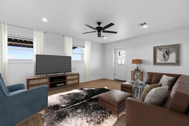 Living room with ceiling fan, visible vents, rece