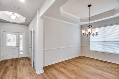 Dining room  featuring an inviting chandelier, woo