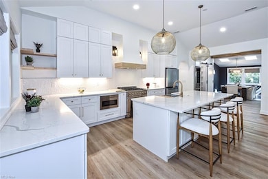 Kitchen with hanging designer light fixtures, kitc