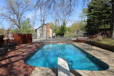 The pool is surrounded by a multi-level deck.