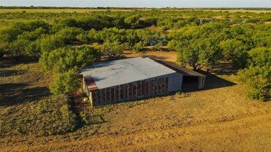 Birds eye view of property with a rural view