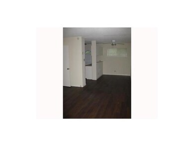 Unfurnished room featuring dark wood-type flooring