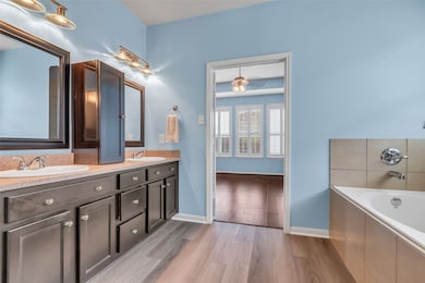 Primary en-suite with custom cabinetry for extra s
