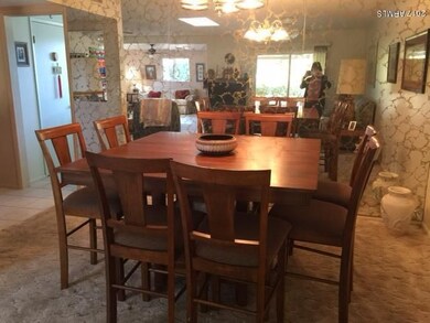 dining room with mirror wall