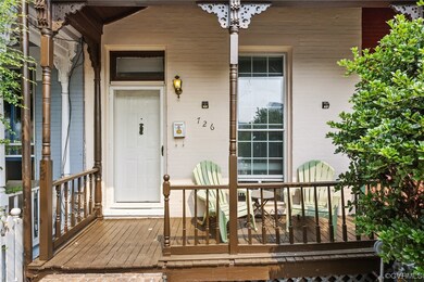 View of exterior entry featuring a deck