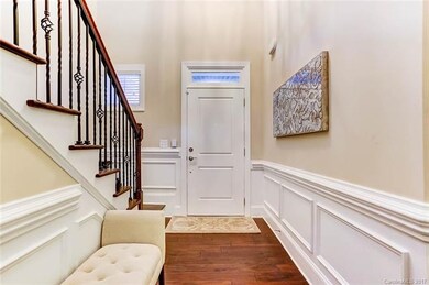 Entry Foyer: Hardwood Floors, Chair and Picture Fr