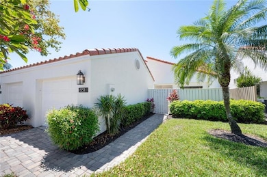 View of property exterior featuring a lawn area