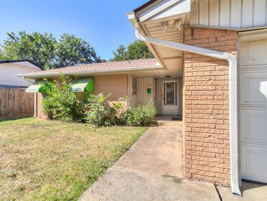 View of exterior entry featuring a lawn