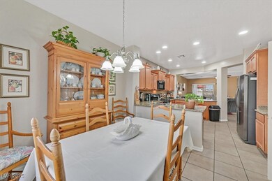 Dining room featuring a chandelier, light tile pat