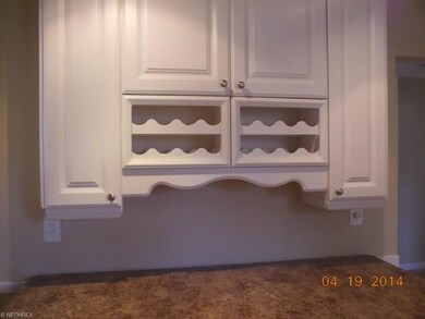 A close up of the wine rack and cabinetry complime