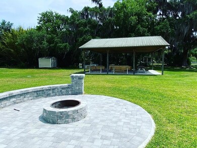FIRE PIT WTIH PAVILION IN BACKROUND 