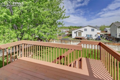 DECK OFF OF LIVING ROOM WITH MOUNTAIN VIEWS!