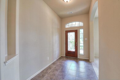 Gorgeous tile floor entry with high ceilings.
