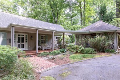 2 car carport has ramp leading to front porch