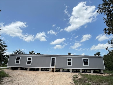 Back of property with entry steps