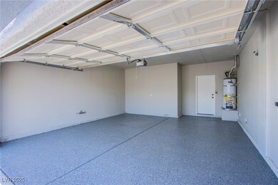 Garage with a garage door opener and strapped wate