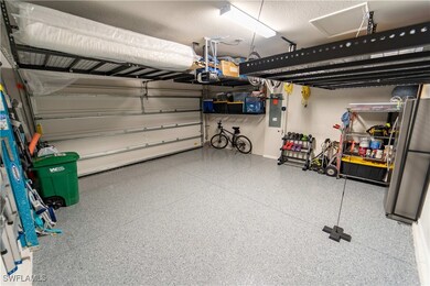 Garage with a garage door opener, electric panel,