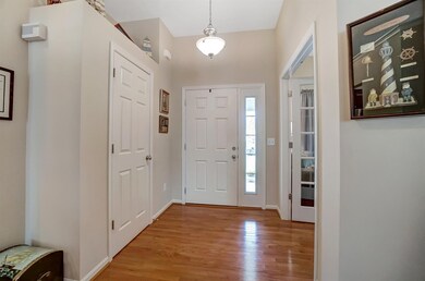 Nice Entry way includes: Wood Floor, Closet, & Transom/Sidelit