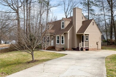 Cape cod home with a front lawn