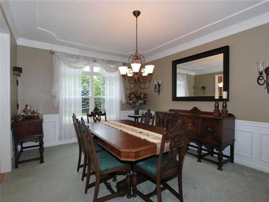 Dining Room. One of the top complaints we hear from buyers is that the dining room is too small and their furniture will not fit.  That will not be a problem here! Extra large room with custom crown molding, wainscoting, and a lovely view as a bonus!