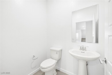 Half bath featuring toilet and wood finished floor
