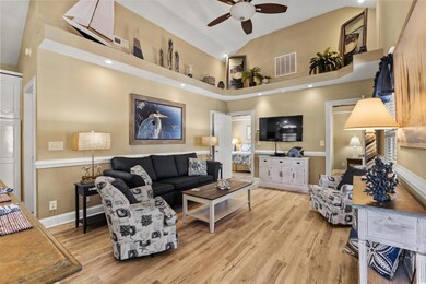 Living room with light hardwood / wood-style floor
